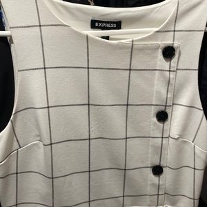 White and grayish dress button in the side.